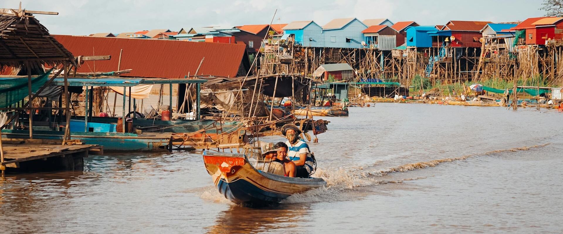 Iconic Kratie riverside sunset in Cambodia for a vibrant Kratie Travel banner with Legend Travel Group.